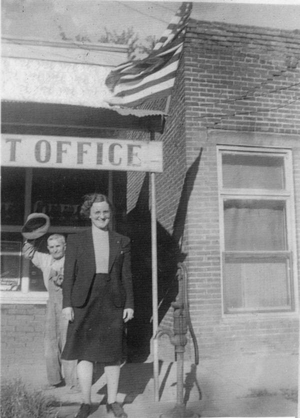 Postmaster Frances Parker in front of “Doc” Slagley at the Alma Post Office