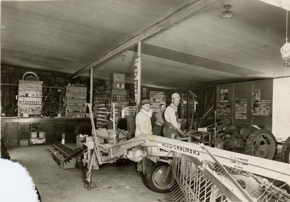 Vernon Gragg with two others at Allis Chalmers store